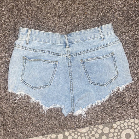 Light washed, ripped, jean shorts. - Picture 2 of 2